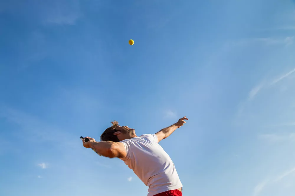 man playing tennis man playing tennis